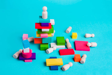 Leadership concept, winner. Figurine of a man on a pedestal