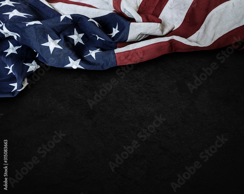 Flag of the United States of America on cement background with copy space