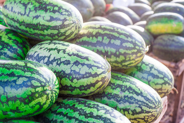 Sweet watermelon, a large number of large green organic crops on the farmers market in Thailand, Asia. Fruit for weight loss and high vitamin C.soft focus.