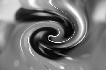 Bright black-white and gray satin or silk fabric with large swirl folds. The material is flexible and light in design, can be used as wallpapers and backgrounds. Abstract background, selective focus.