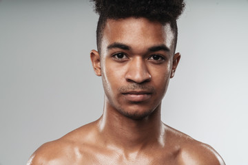 Photo of african american man looking at camera while working out