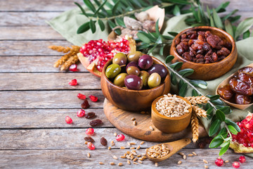 Tu Bishvat holiday symbols - dried fruits, pomegranate, barley, wheat