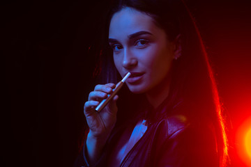 Electronic cigarettes, technology cigarette. Woman smoking e-cig