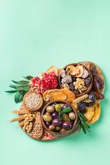 Tu Bishvat holiday symbols - dried fruits, pomegranate, barley, wheat