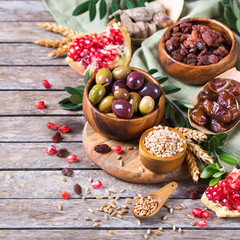 Tu Bishvat holiday symbols - dried fruits, pomegranate, barley, wheat