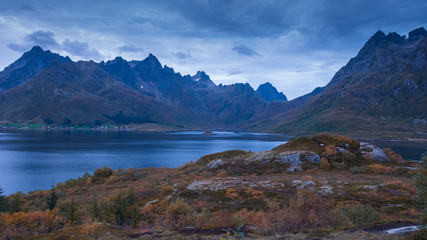  mountains on the fjord in the evening twilight on the Lofoten islands in autumn Norway
