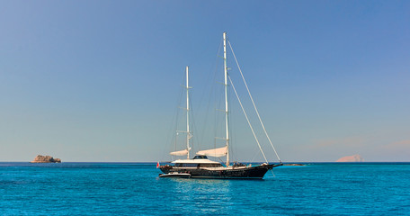 Tourism, travel, vacation on the rocky sea.