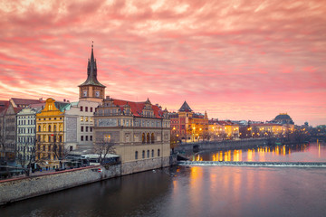 Fototapeta na wymiar Historic buildings with the National Theater on the Vltava river bank at sunrise in Prague, Czech Republic, Europe.