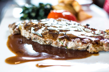 T-bone steak with black pepper sauce.