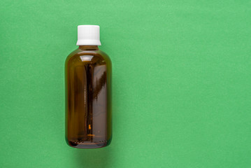 Bottle for medicine or cosmetics. Olive tones.