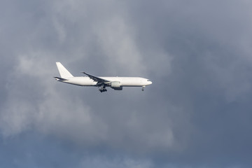 Fototapeta na wymiar Cargo airplane with landing gear in the sky before landing.