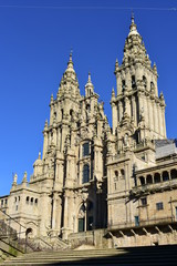 Fototapeta na wymiar Cathedral, baroque facade and towers from Praza do Obradoiro with blue sky. Santiago de Compostela, Spain.