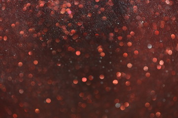 The bokeh of the glitter surface that reflects with neon light.