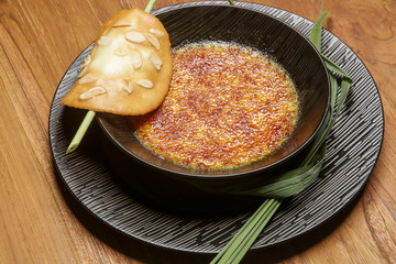 Lemongrass broulee, Lemongrass infused Cream Custard served with crispy caramel and almond tuile	
