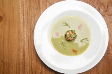 Chilled cucumber soup with salmon tartare. Exquisite dish. Creative restaurant meal concept.