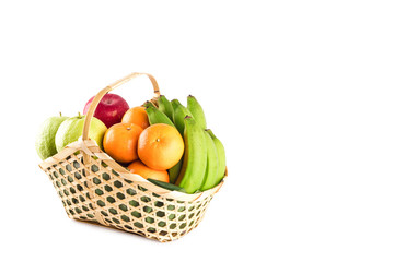 orange, guava, banana and apple in wicker basket on white background fruit health food isolated