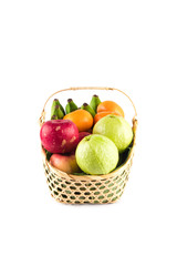 madarin orange, guava fruit, banana and red apple in gift basket on white background fruit health food isolated