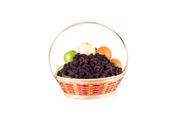 fresh orange, Chinese pear, green apple and mulberry in bamboo wicker basket on white background fruit health food isolated
