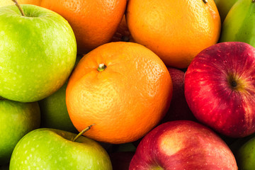 green apple and orange and red apple and banana are mixed tasty fruit composition on  background fruit health food