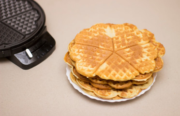 Fried waffles (pancakes) from above on a solid background