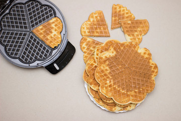 Fried waffles (pancakes) from above on a solid background