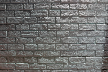 Dark brick wall background.