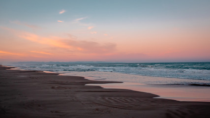 Wild beach with sandy dunes at sunset by the Mediterranean Sea in Valencia Spain