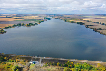 Reservoir. Pond. Drone arial view Ukrainian open spaces. Lakes, water