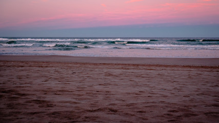 Wild beach with sandy dunes at sunset by the Mediterranean Sea in Valencia Spain