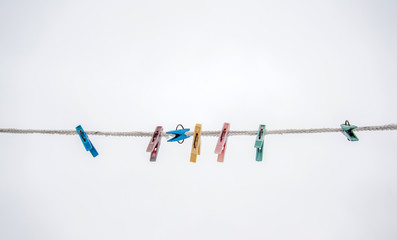 multicolored clothespins on a rope