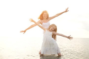 mother with daughter at the sea