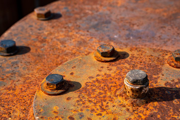 The metal surface and hex nut is filled with rust that is reddish brown. .Gives a retro and vintage feel.