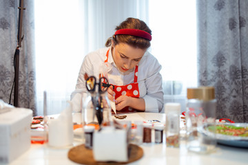 A young housewife makes cookies to celebrate