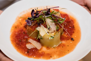 Cannelloni with bolognese sauce in a white plate. Italian pasta