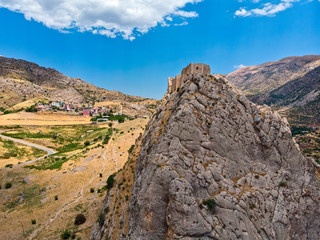 Aerial view of Kahta Castle, Kalesi. The Yeni Kale Fortress in Eski Kahta is perched atop a hill with a steep slope. Walls of the manor surround the entire hill. Very close to Mount Nemrut. Anatolia. 