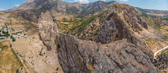 Aerial view of Kahta Castle, Kalesi. The Yeni Kale Fortress in Eski Kahta is perched atop a hill with a steep slope. Walls of the manor surround the entire hill. Very close to Mount Nemrut. Anatolia. 