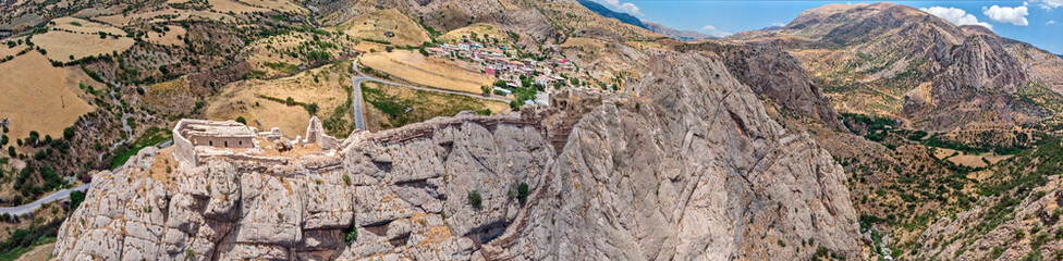 Aerial view of Kahta Castle, Kalesi. The Yeni Kale Fortress in Eski Kahta is perched atop a hill with a steep slope. Walls of the manor surround the entire hill. Very close to Mount Nemrut. Anatolia. 