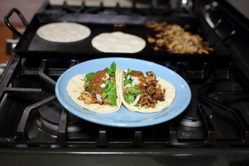Pork tacos on a plate also known as 