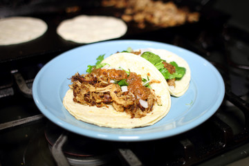 Pork tacos on a plate also known as 