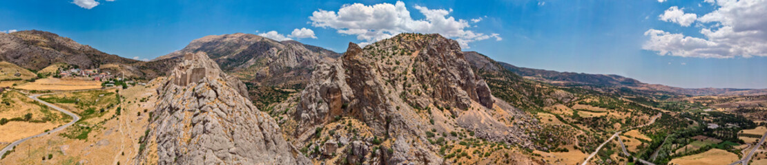 Aerial view of Kahta Castle, Kalesi. The Yeni Kale Fortress in Eski Kahta is perched atop a hill with a steep slope. Walls of the manor surround the entire hill. Very close to Mount Nemrut. Anatolia. 