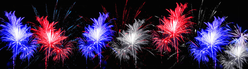 Firework at night in the colors of the flag from the united states of america (blue, white and red)