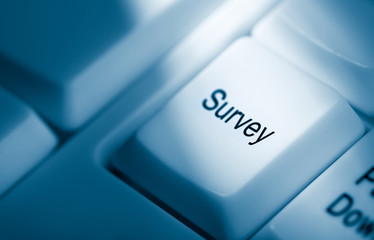 Online Survey concept on blue computer keyboard