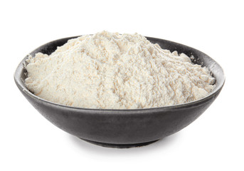 Fototapeta na wymiar Bowl with flour on white background