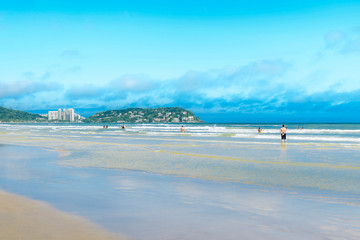 Beautiful day at a touristic brazilian beach. Paulista seacoast, Praia da Enseada beach at Guaruja...