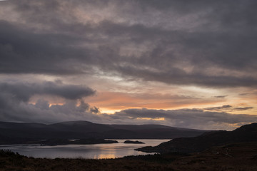 Fototapeta na wymiar A calm winter sunset over Upper Loch Torridon in Wester Ross, Scottish Highlands, Scotland. 24 December 2019