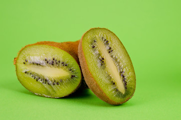 .Kiwi fresh and juicy large shot on a bright green background