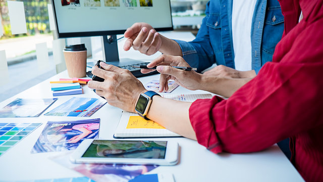 Advertising agency designer creative start-up team discussing ideas in office.  - Powered by Adobe