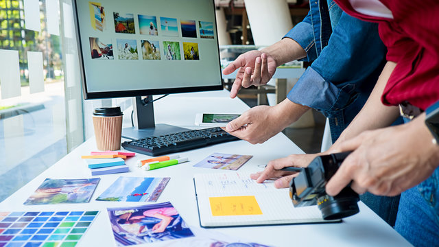 Advertising agency designer creative start-up team discussing ideas in office. 
