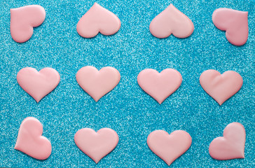 Valentines day pattern background flat lay pink hearts  on a glittering classic blue background with copy space. love wedding romantic concept, minimal top view