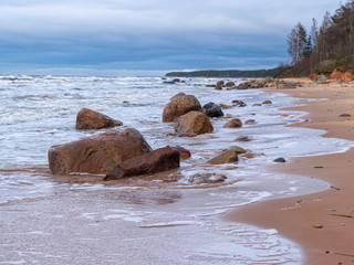 beautiful seascape, dark clouds and white waves